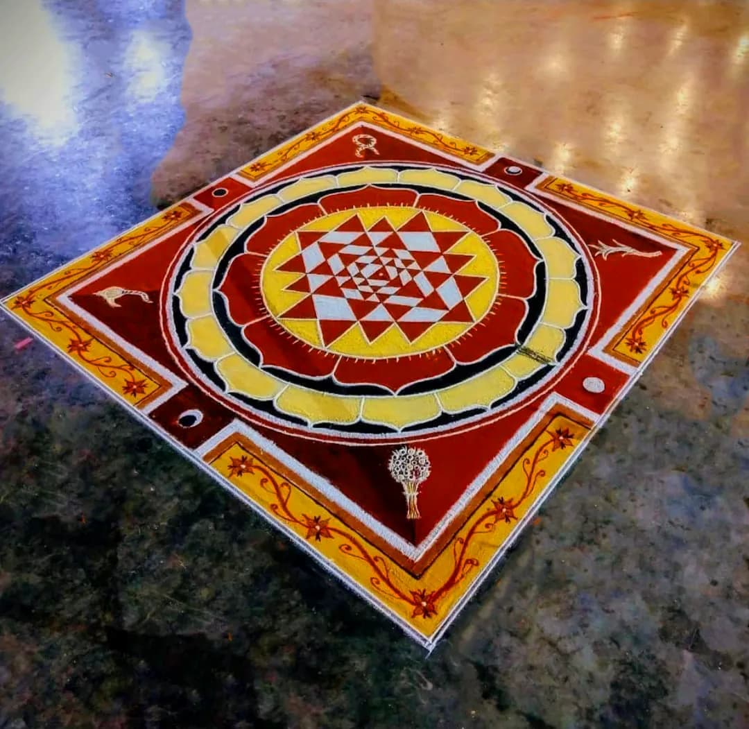 Sri Chakra rangoli in red and gold