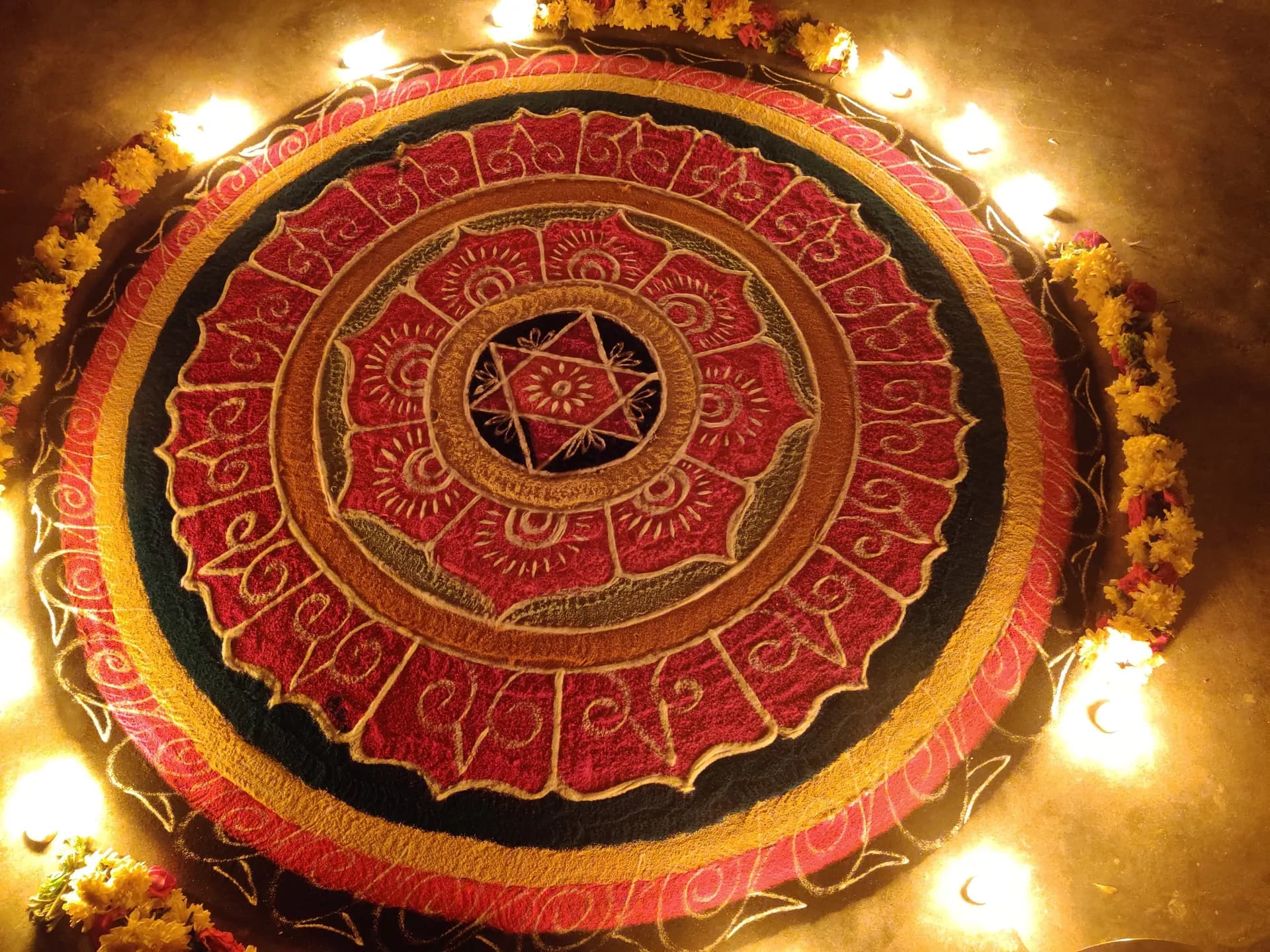 Traditional mandala rangoli with diyas