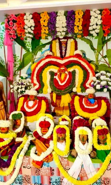 Deity decorated with flower garlands